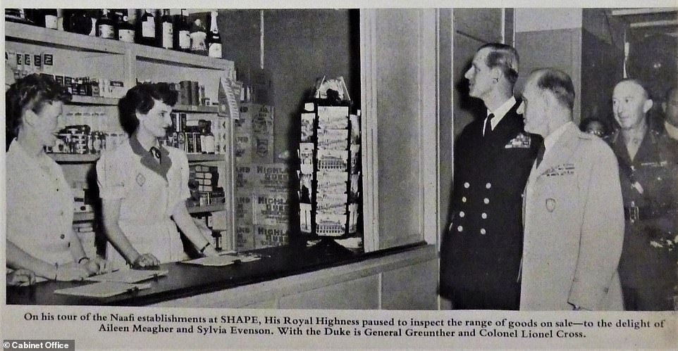 Prince Philip inspects goods on sale on his tour of the Navy, Army and Air Force Institutes (NAAFI) establishments at Supreme Headquarters Allied Powers Europe (Shape) in 1954 with General Gruenther and Colonel Lionel Cross
