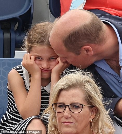 The little princess could be seen squinting in the sunlight as she watched the match today  before placing her head in her hands (pictured)