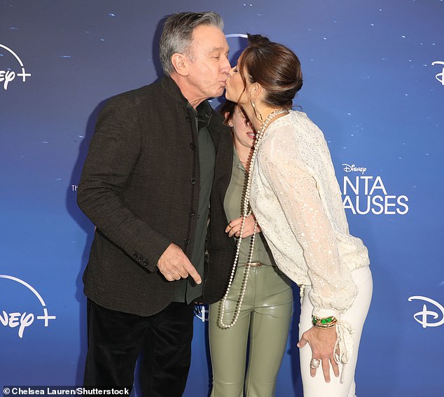 Locking lips: Tim Allen enjoyed a loving embrace with wife Jane Hajduk on The Santa Clauses red carpet in Burbank on Sunday