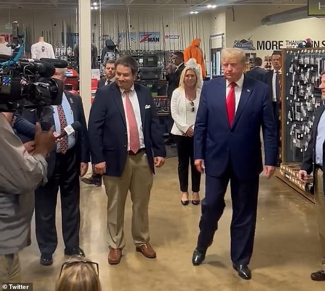 Rep. Marjorie Taylor Greene (in back wearing white) was with Donald Trump