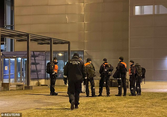 Finnish border guards wait at the Nuijamaa border checkpoint in Finland, on November 17, 2023