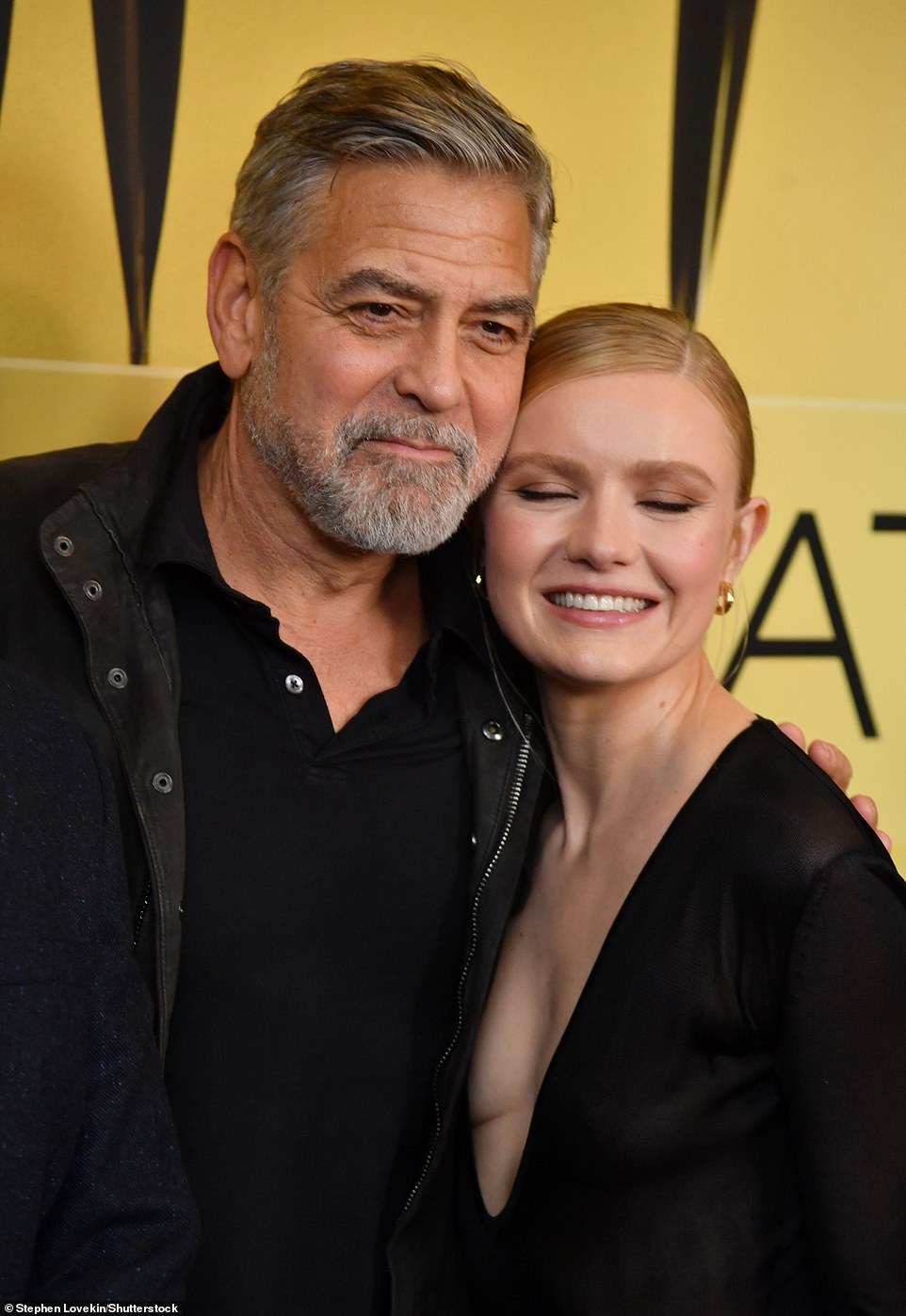 Instead, cozying up to Clooney on the red carpet was actress Hadley Robinson (R), who portrays Joyce Simdars in The Boys in the Boat