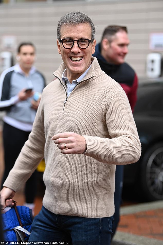 Anton Du Beke cut a dapper figure in a beige quarter zip and his round glasses