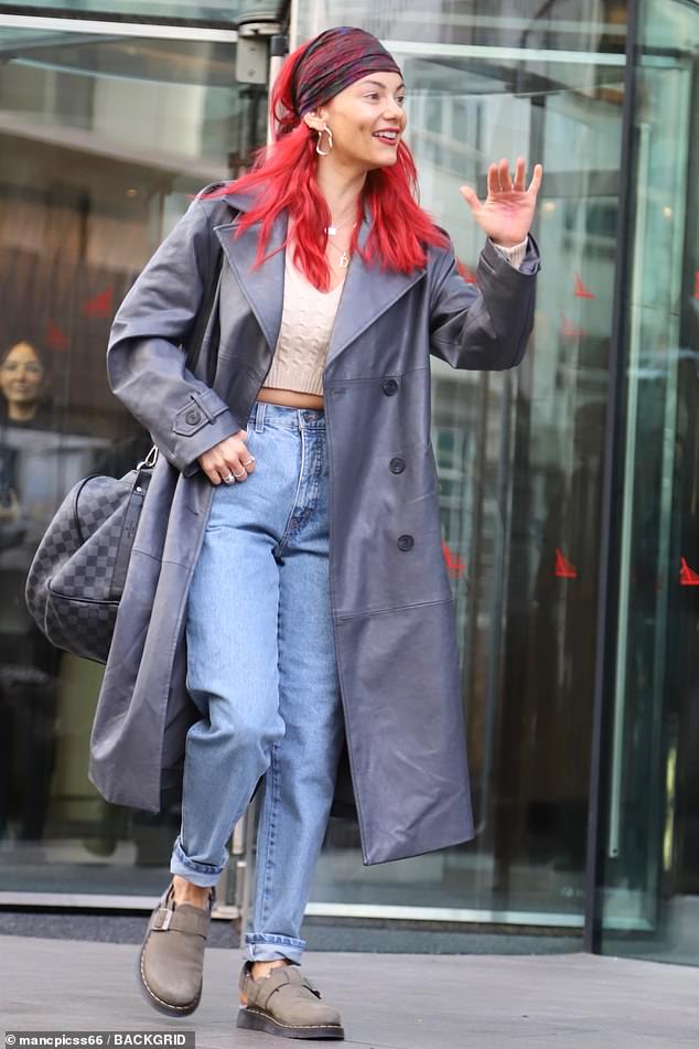 Bobby's partner Dianne Buswell looked stylish as she swept her bright red hair back from her face with a bandana