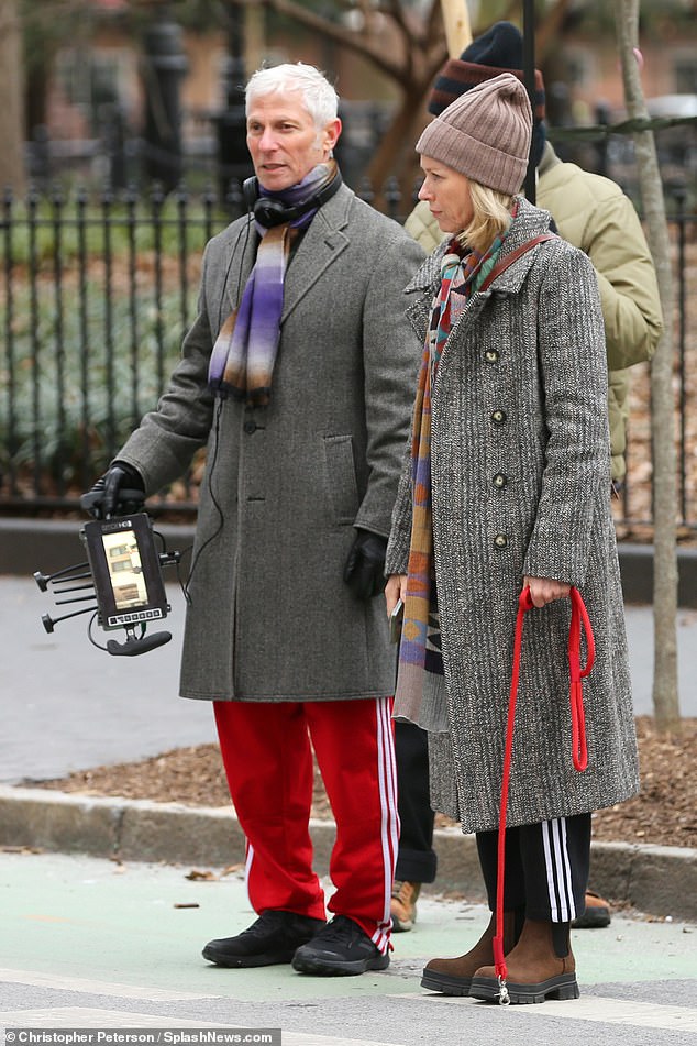 For the second part of the day's shoot Watts worked on her upcoming scene with co-director David Siegel after a wardrobe change into a gray overcoat with black sweatpants, brown beanie cap and boots