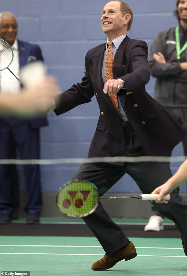 Prince Edward takes part in a badminton match during an engagement at the All England Open Badminton Championships in Birmingham