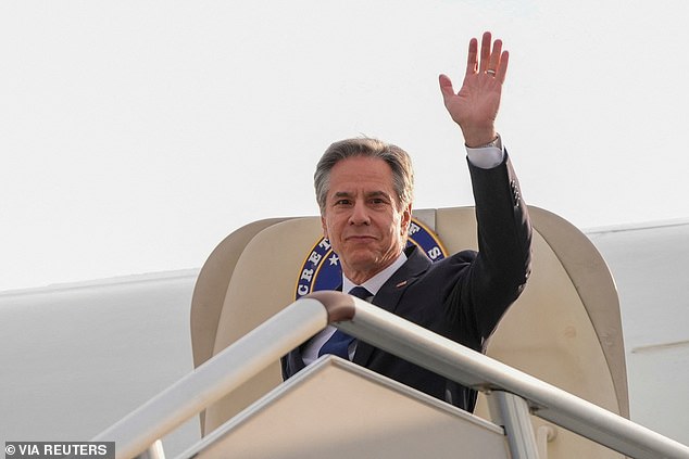 U.S. Secretary of State Antony Blinken waves upon his arrival in Shanghai, China