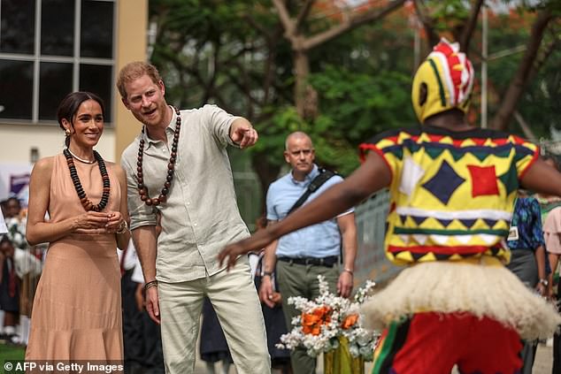 The Duke and Duchess watch dancers at the Wuse Lightway Academy in Abuja this morning