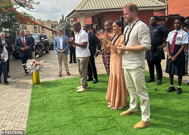 Harry and Meghan visit the Wuse Lightway Academy in Abuja today on their tour of Nigeria