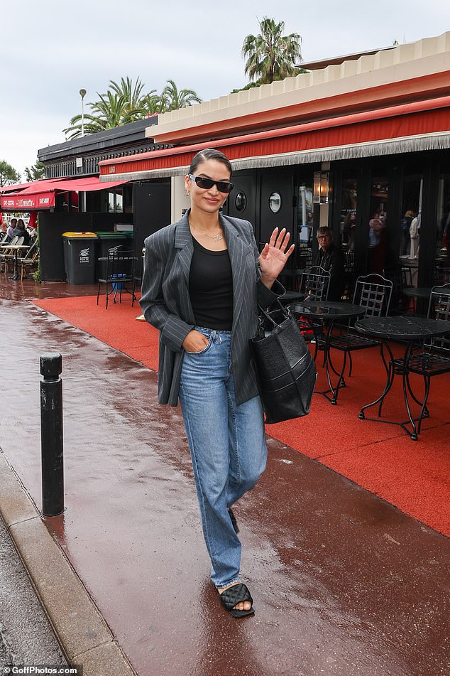 She swept her hair up in a bun and donned hoop earrings and diamond pendant necklace with her one-year-old son Zai's name