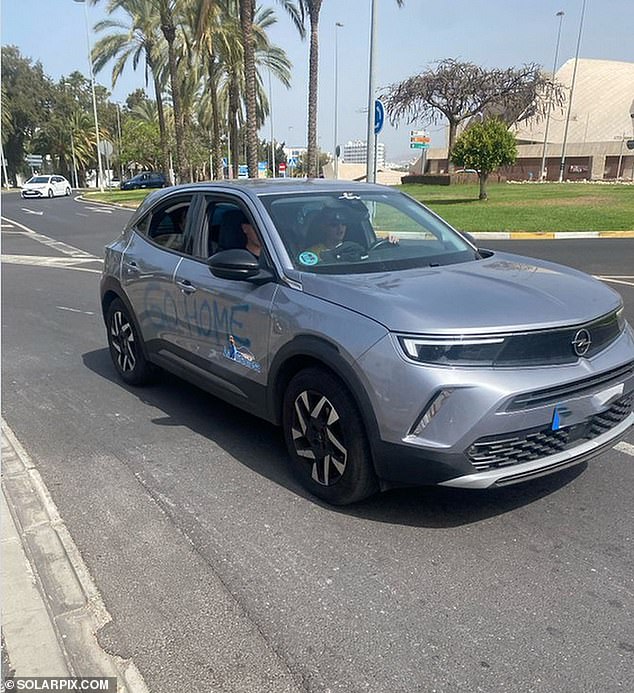 A rental car is seen sprayed with 'Go Home' in Tenerife