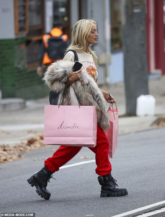 With phone in hand, Jackie crossed the street to her car