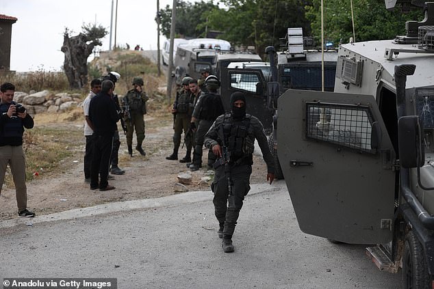 Israeli forces are seen as they demolish a Palestinian-owned house that it was allegedly 'unauthorized' in East Jerusalem on May 2, 2024