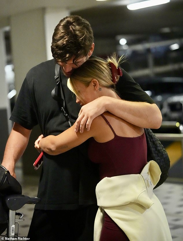 They could not keep their hands off each other, cuddling up as they made their way through the terminal