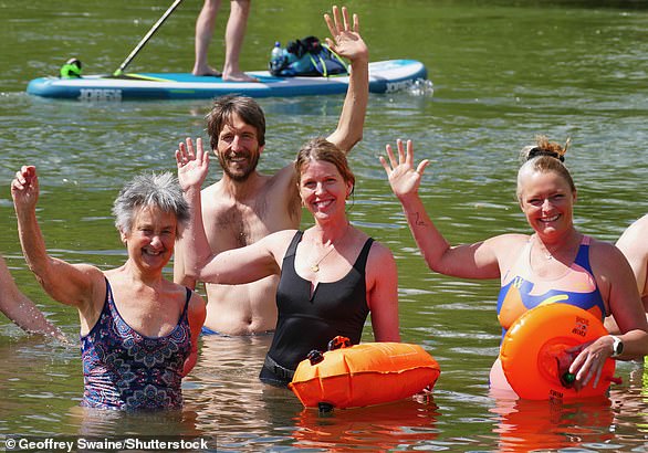 Enjoying nature: Wild swimmers from the Henley Mermaids group take a dip in the Thames