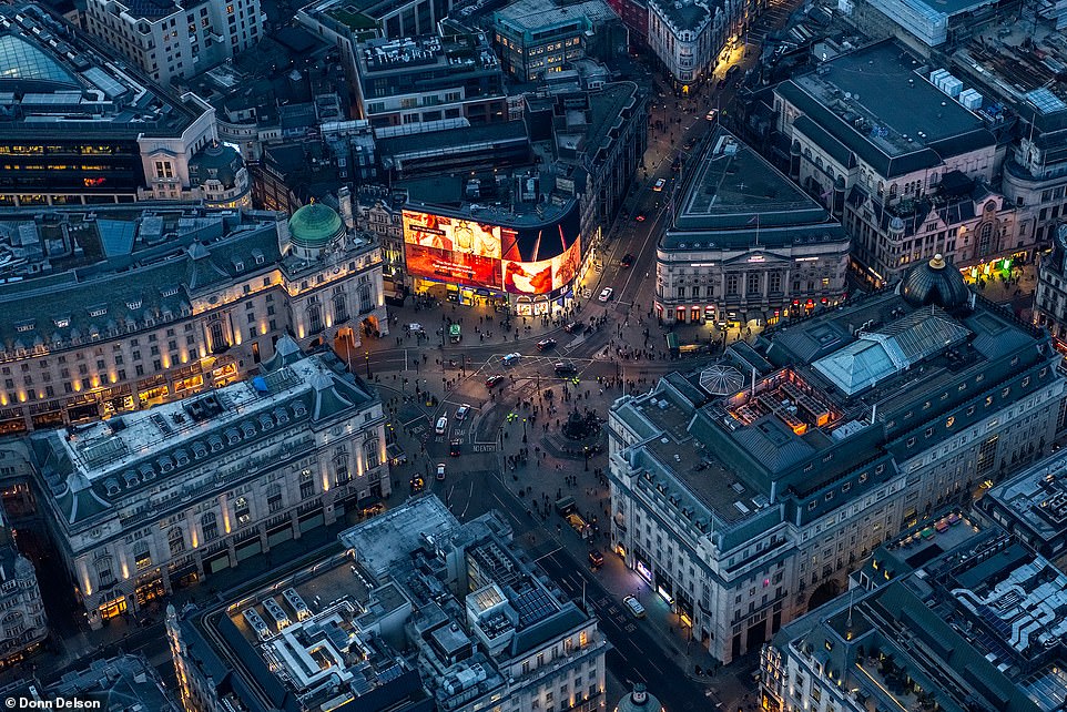 Pictured above is 'Circus Nights', an image of Piccadilly from Donn's 'Point of View' collection. The photographer told MailOnline Travel that the city is one of his favourite places to shoot due to its 'visually exciting views'. He explains: 'Hovering over London as the city lights begin to twinkle is always magical'