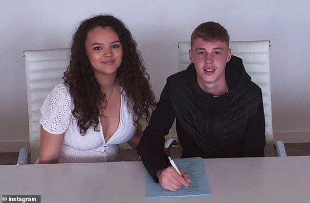 Palmer is pictured with sister Hallie - who he shares a close bond with - signing a Manchester City contract in 2019