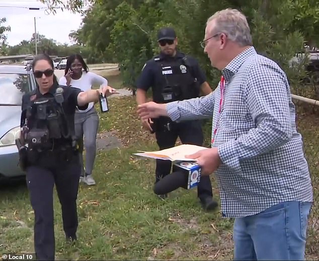 After the violent encounter, Weinsier is handed his badge back by a female officer. Weinsier declined to press charges against Bazile's mother