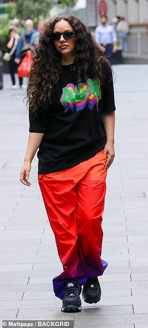 The singer, 31, appeared in good spirits on the outing where she sported a black oversized T-shirt with a multi-coloured print