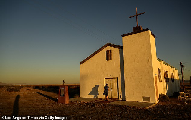 Assistant Manager Nicole Rachel unlocks the small historic church for tourists