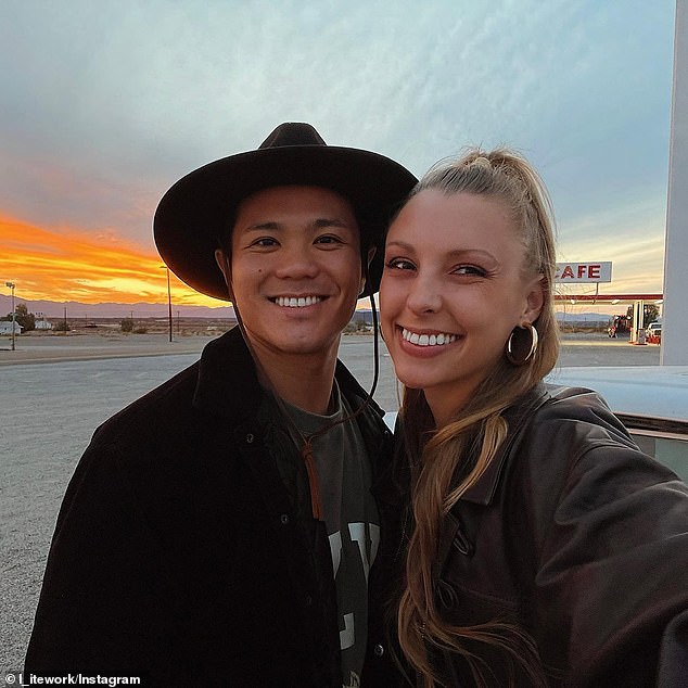 Okura takes a selfie with girlfriend Crysta Bree out in front of Roy's as the sun sets