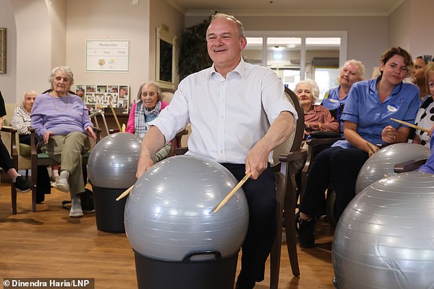 Meme account Insane Moments in British Politics shared clips of Davey belting out We Will Rock You on drums made from an exercise ball as part of a bizarre photo-op last week - which alone has 1.9 millions views on X