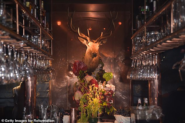 The interiors accentuate Casa Cruz's understated but opulent aesthetics, featuring mood lighting, floral imagery, and chic rustic décor - including a deer's head