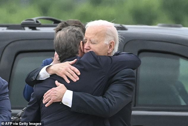 US President Joe Biden hugs his son Hunter Biden upon arrival at Delaware Air National Guard Base in New Castle, Delaware, on June 11, 2024