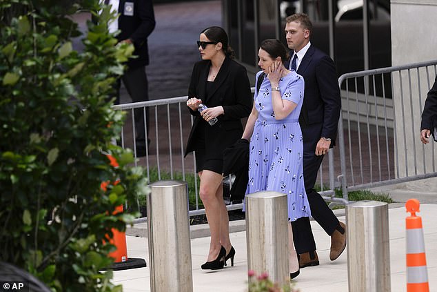 Naomi Biden (left) departs court on Friday alongside husband Peter Neal (right). The young couple are heading to the G7 with President Joe Biden and Naomi's sisters Finnegan and Maisy on the heels of their father's federal gun conviction