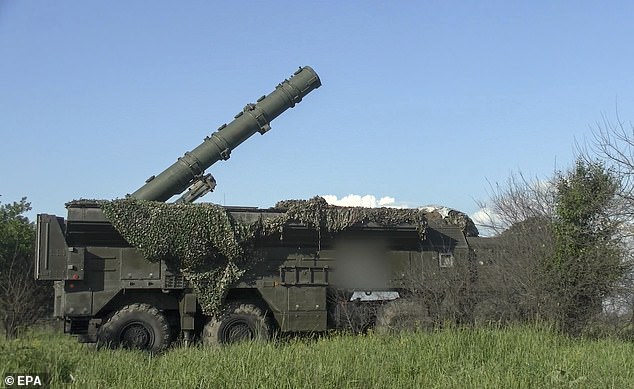 A still image taken from a handout video made available by the Russian Defence Ministry press-service shows Russian servicemen operating a non-strategic nuclear missile for Iskander operational-tactical missile system during the second stage of tactical nuclear drills of Russian and Belarus armed forces at an undisclosed location