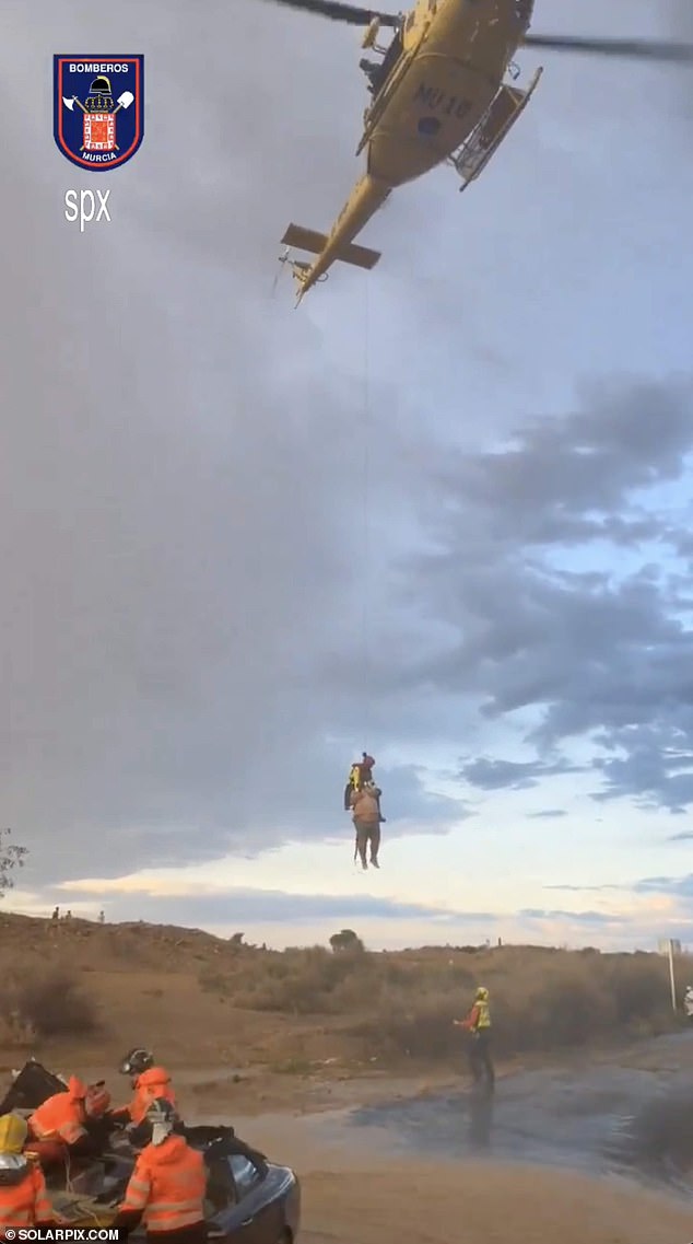 The man was airlifted from the car by helicopter after he was rescued from the floods