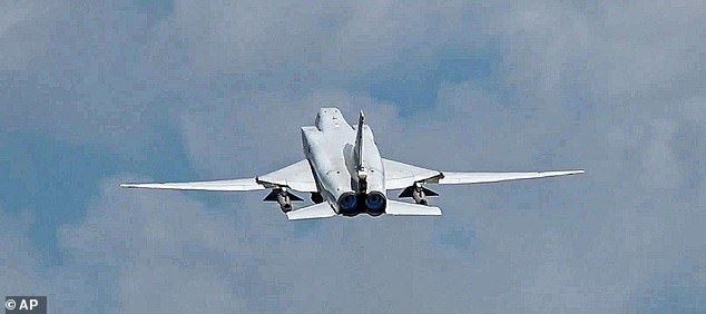 In this photo taken from video on Monday, June 10, 2024, and released by the Russian Defense Ministry Press Service, A Russian Tu-22M3 bomber is seen in flight during joint Russian-Belarusian drills intended to train the military to use tactical nuclear weapons