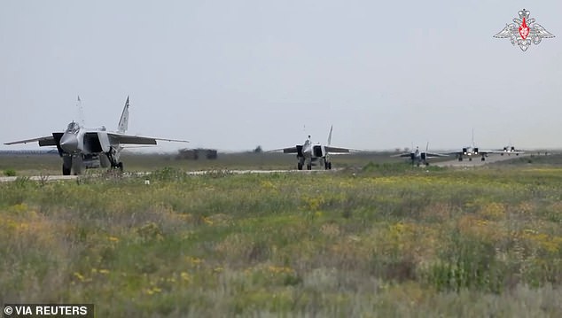 Military jets take off from the airfield during the second stage of tactical nuclear drills of the armed forces of Russia and Belarus at an undisclosed location, in this still image from video released June 11, 2024