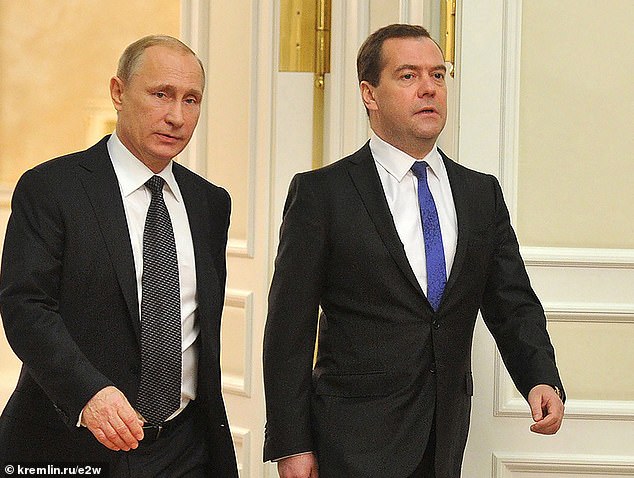 Dmitry Medvedev, (R) deputy head of the Kremlin's powerful security council, and a former Russian president and prime minister, pictured with Vladimir Putin (L)