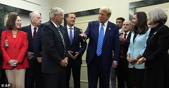 Republican presidential candidate former President Donald Trump gestures before he speaks at the National Republican Senatorial Committee, Thursday, June 13, 2024, in Washington. (AP Photo/Evan Vucci)