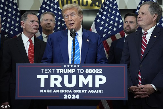 Republican presidential candidate former President Donald Trump talks to reporters at the National Republican Senatorial Committee, Thursday, June 13, 2024, in Washington. (AP Photo/Evan Vucci)