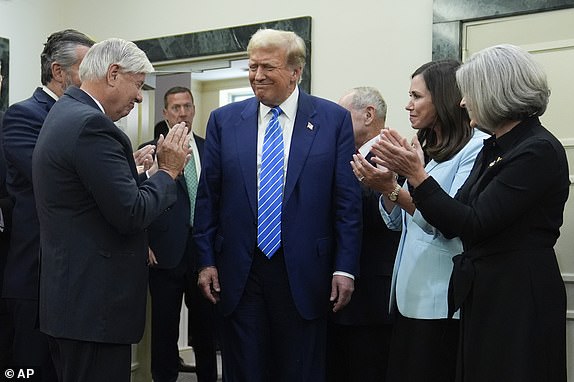 Republican presidential candidate former President Donald Trump arrives to speak with reporters at the National Republican Senatorial Committee, Thursday, June 13, 2024, in Washington. (AP Photo/Evan Vucci)