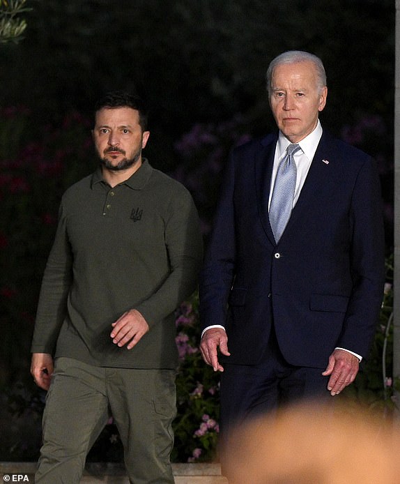 epa11408544 US President Joe Biden (R) and Ukrainian President Volodymyr Zelensky (L) arrive to sign a security agreement after a bilateral meeting on the sidelines of the G7 summit in Savelletri (Brindisi), Italy, 13 June 2024. The 50th G7 summit will bring together the Group of Seven member states leaders in Borgo Egnazia resort in southern Italy from 13 to 15 June 2024.  EPA/ETTORE FERRARI
