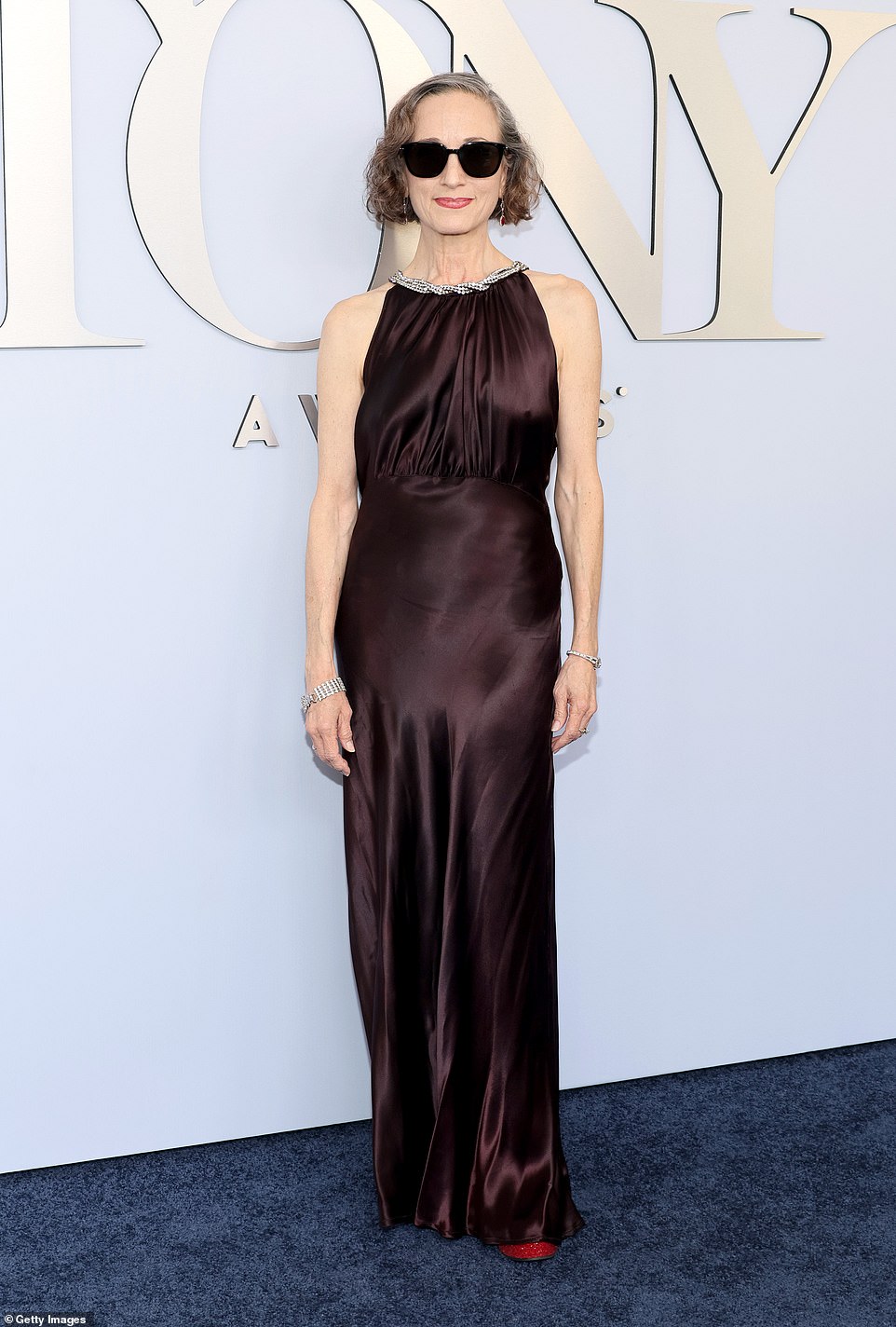 Bebe Neuwirth chose a chocolate hued gown with a crystal embellished neckline
