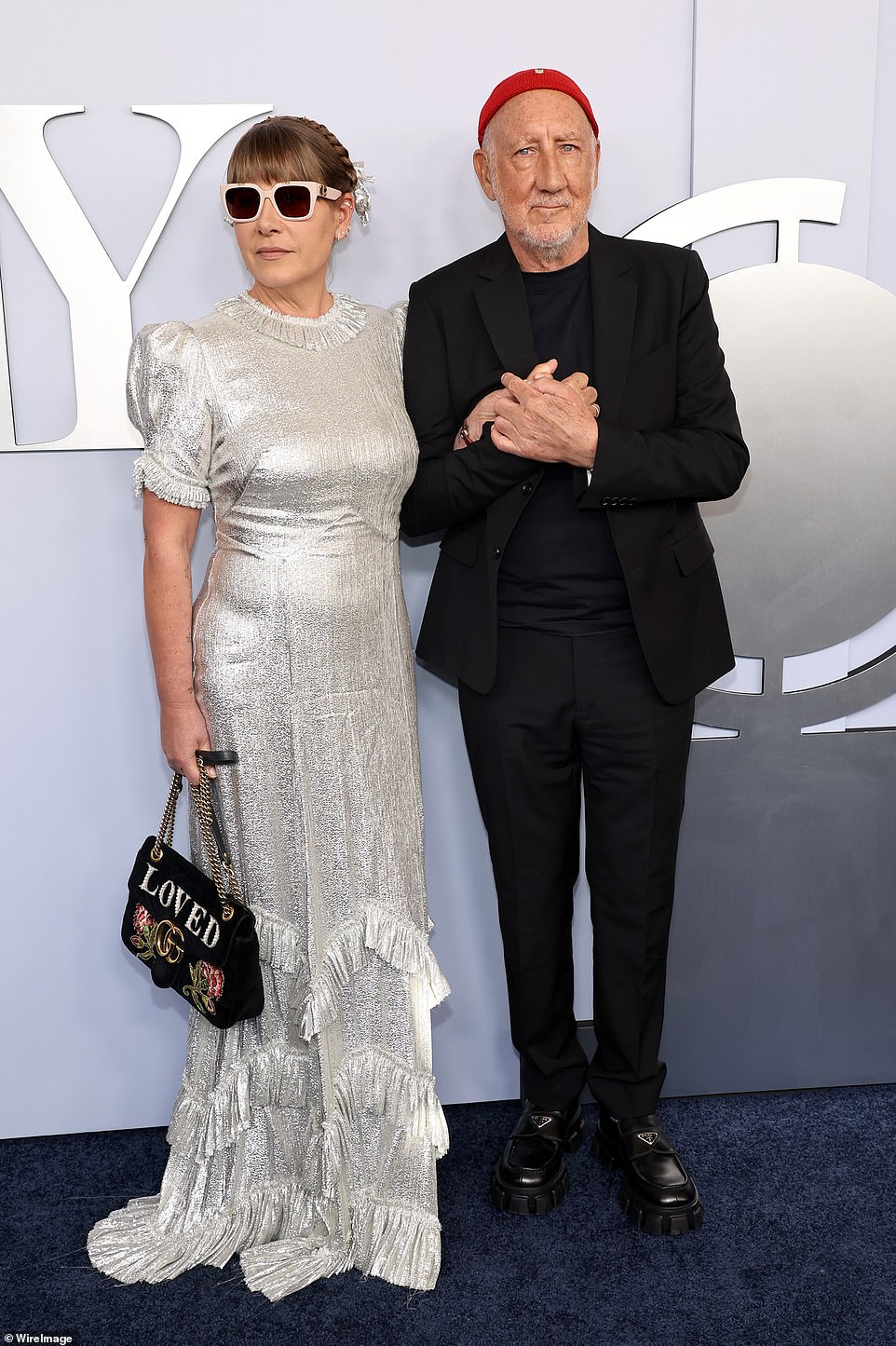 Rachel Fuller chose a fringed silver gown and a Gucci bag; pictured with husband Pete Townshend