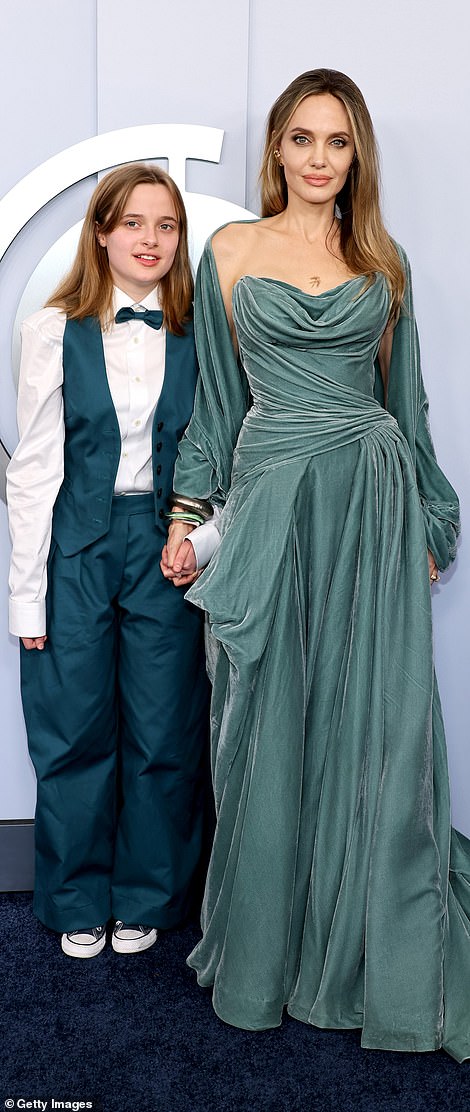 Vivienne wore an emerald vest and trousers