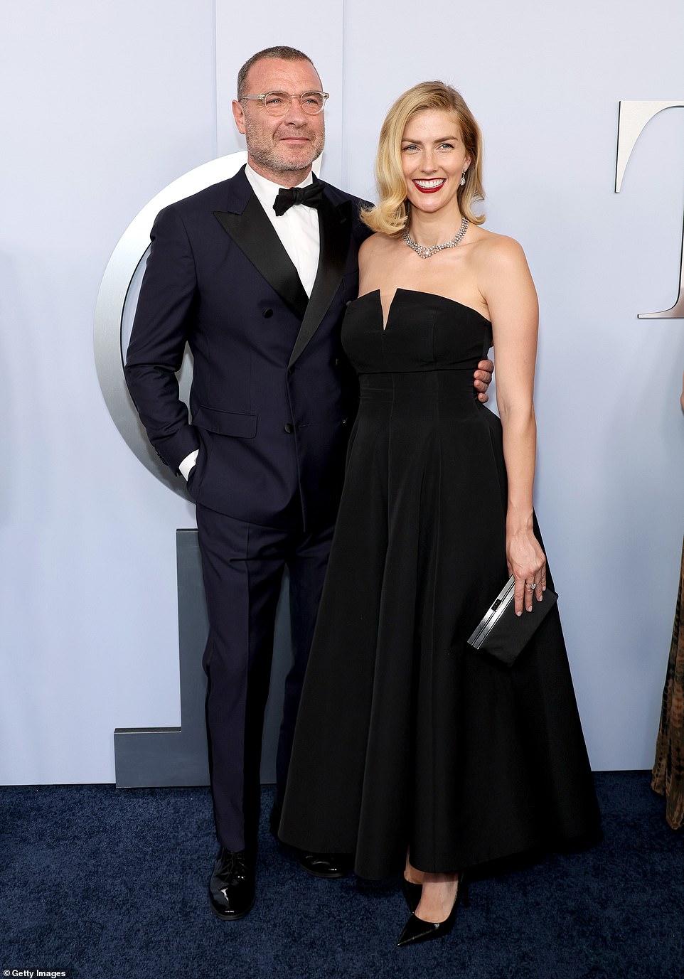 Liev Schreiber, 56, arrived with wife Taylor Neisen, 32; Liev wore a dark blue and black suit with a white button up and bowtie while Taylor chose a classic black strapless dress