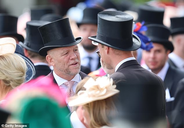 During the reception, Zara's husband Mike showed he is just as warm as his wife. Pictured speaking with William