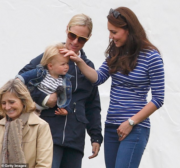 Kate, Zara and her daughter Mia share a warm moment in 2015, as they attend the Gigaset Charity Polo Match at the Beaufort Polo Club