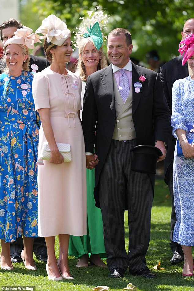 The loved up couple was pictured kissing today as they attended the equestrian event on Friday