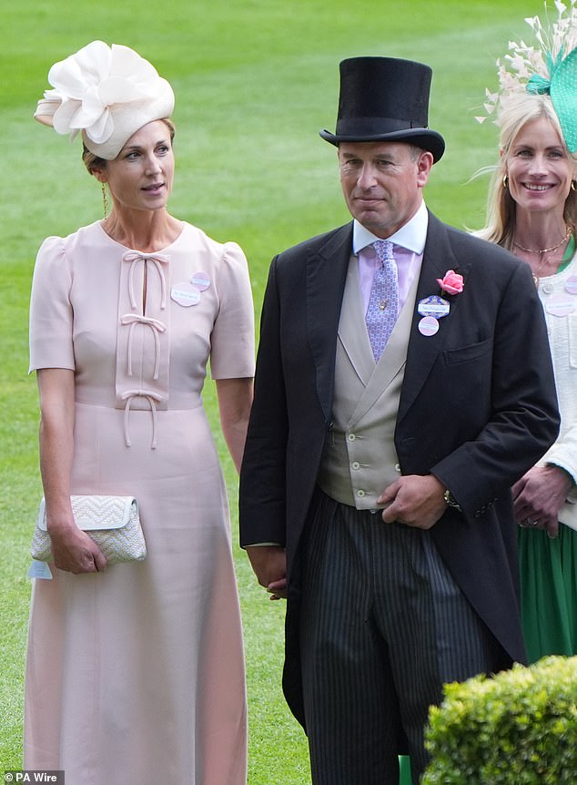 Harriet and Peter held hands as they enjoyed today's outing, looking very loved up during the event