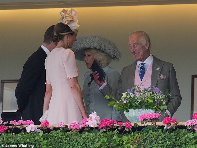 The King appeared to be high spirits as he spoke with Harriet - who laughed as she met the monarch