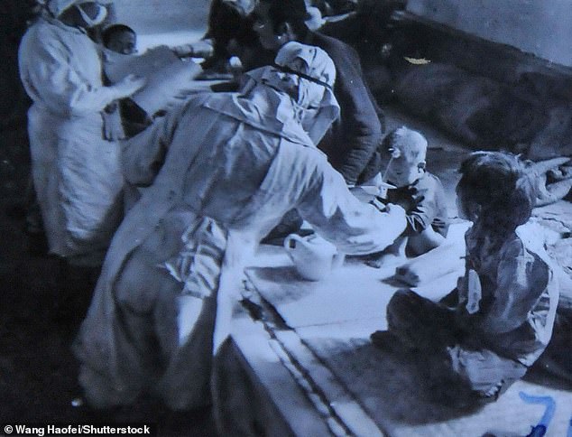 Staff of the Manchukuo puppet state carrying out bacteriological tests on babies and small children - directed by Japan's Unit 73 Japanese Army's Unit 731 - in November 1940