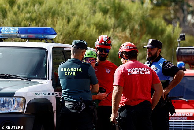 Police officers and firefighters talked while searching for the missing 19-year-old on June 19