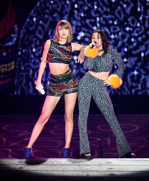 Fans have long speculated that Charli and Taylor have bad blood, with the two singers' latest albums currently battling in the charts (pictured performing together in 2015)